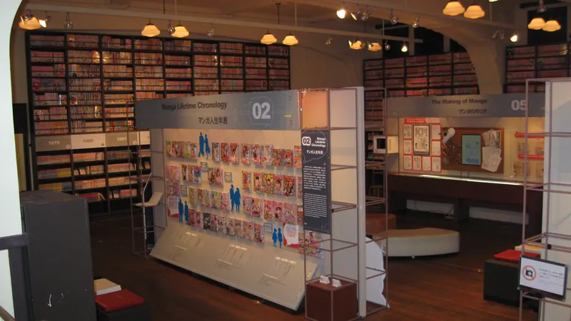 Floor-to-ceiling shelves of manga volumes and exhibit panels inside the Kyoto International Manga Museum