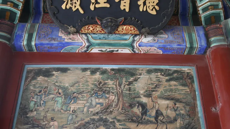 A painted panel of figures in a landscape beneath a gilded inscribed plaque on the Long Corridor of Beijing's Summer Palace